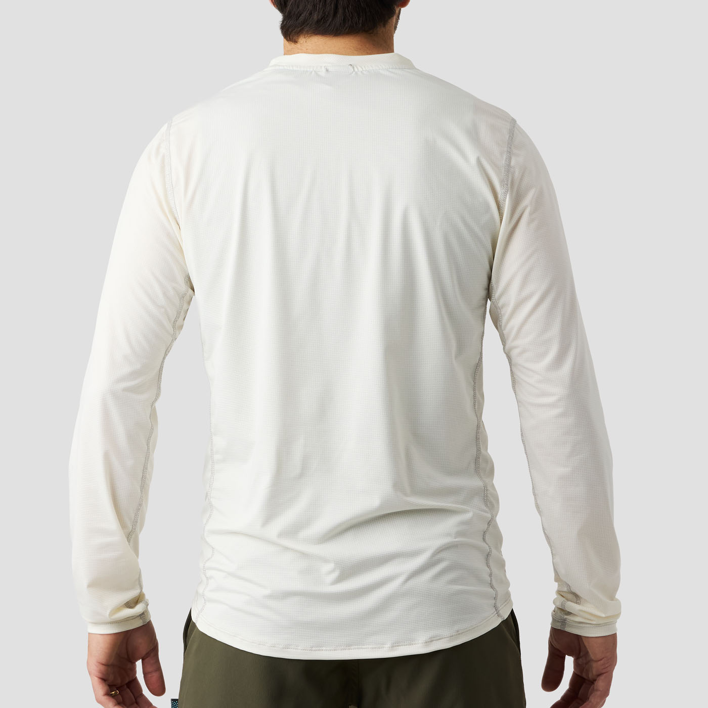 Back view of Ornot Men's UV Trail Shirt in Oat, loose-fit long sleeve UV shirt for cycling, gravel, and adventure