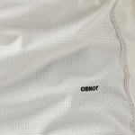 Detail of men's cream UV Trail Shirt fabric by Ornot, lightweight breathable material with UPF 30 sun protection