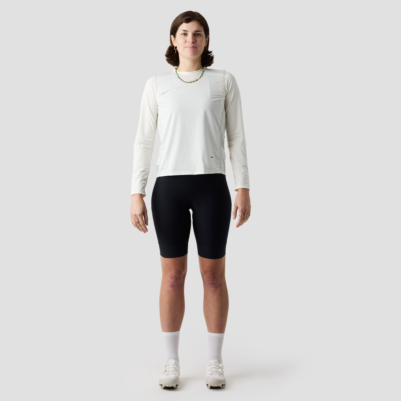 Detail of women's cream UV Trail Shirt fabric by Ornot, lightweight breathable material with UPF 30 sun protection