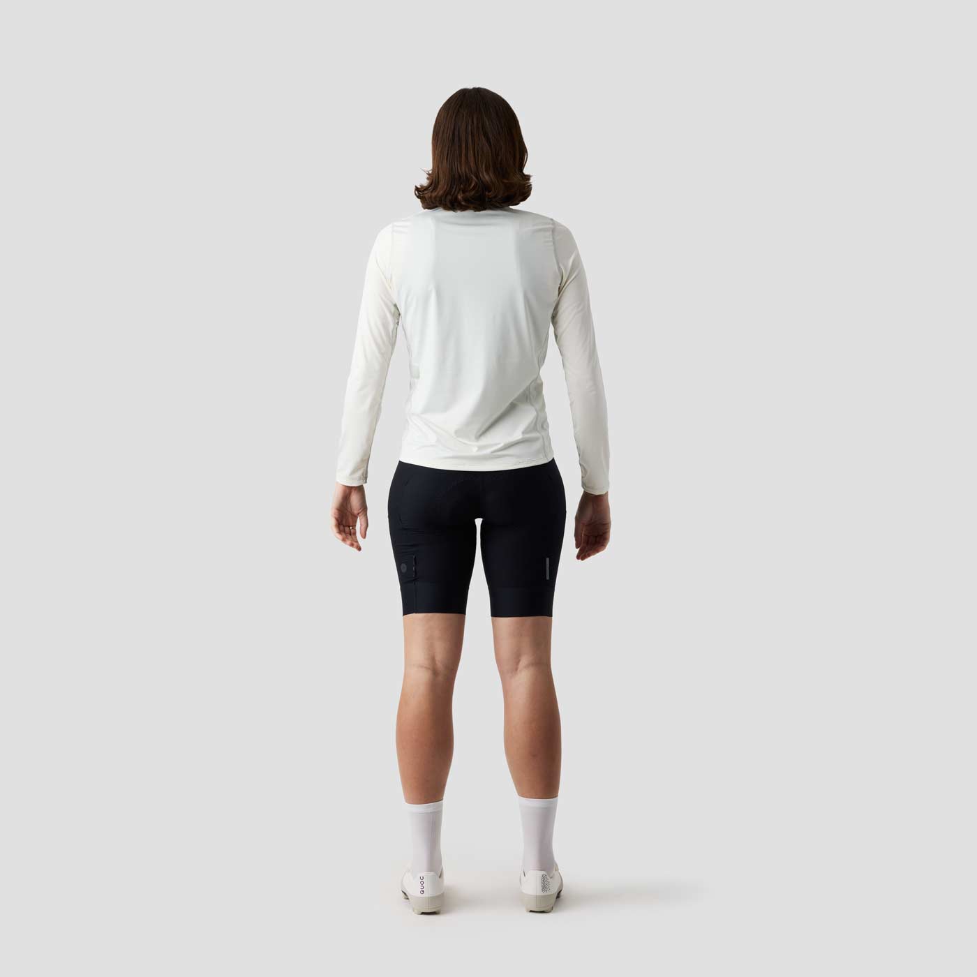 Women's UV Trail Shirt in Oat laid flat, Ornot's long sleeve sun shirt for gravel riding and warm weather cycling